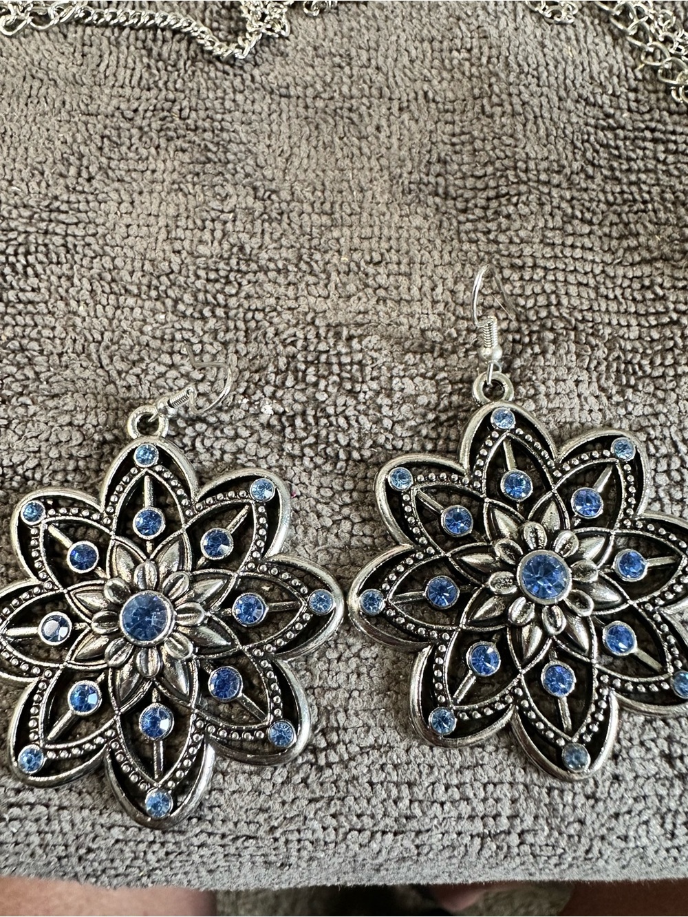 Silver Floral Drop Earrings with Blue Gem Accents